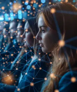 A young woman looks intently at a screen, with digital network lines and glowing nodes overlaid, symbolizing connectivity and technology. Several blurred figures are visible in the background, engrossed in the same activity—perhaps they're all exploring About Envy Websites together.